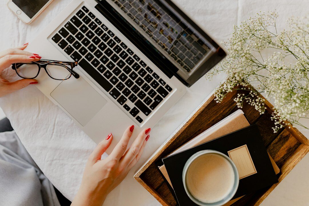 writer typing on laptop