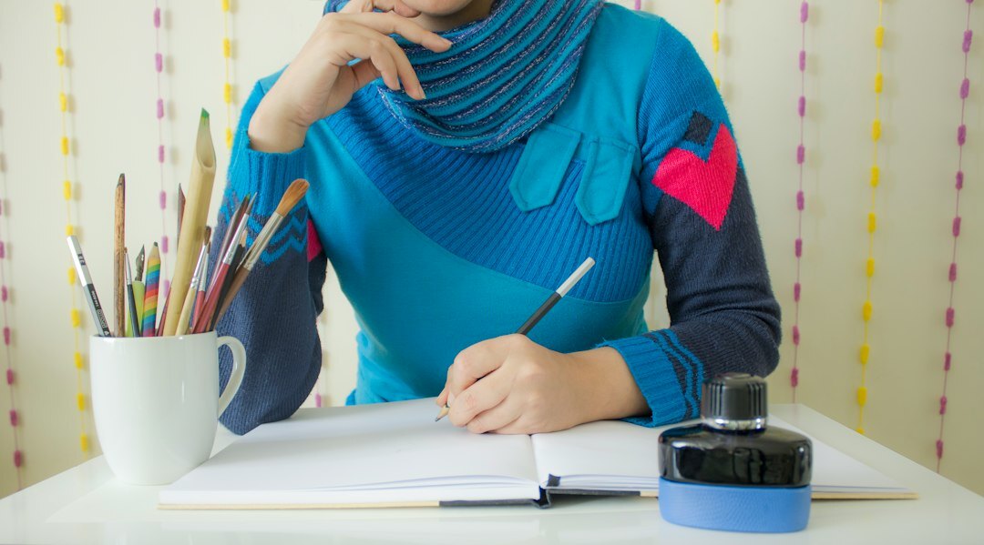 mystery writer at desk with notebook